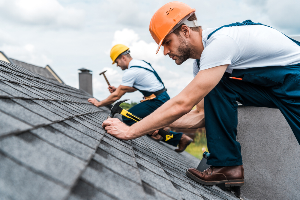 Roofers working on roof